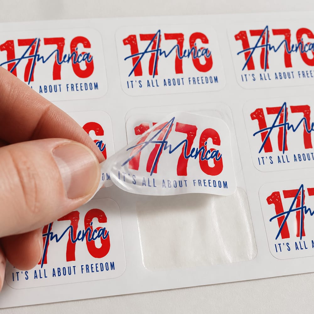 Sticker sheet mockup with a hand peeling one off