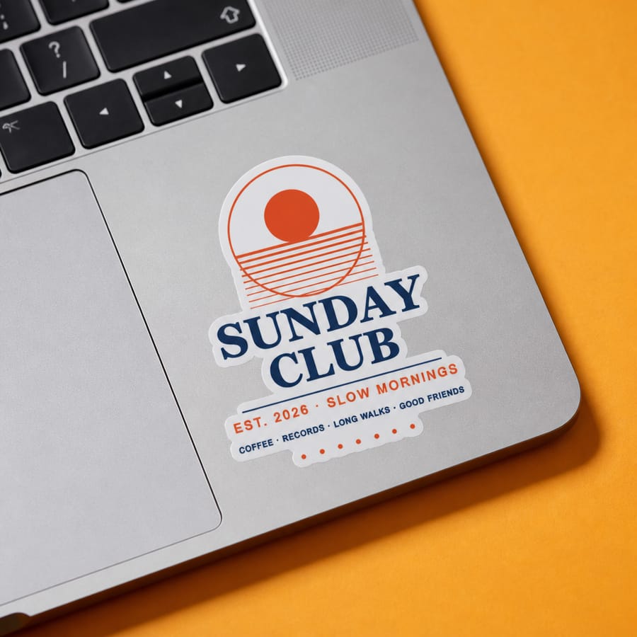 Sticker mockup on a laptop on an orange background
