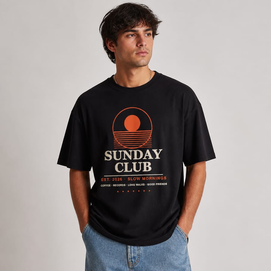 New AI t-shirt mockup: oversized black tee on a natural-looking model with hands in pockets